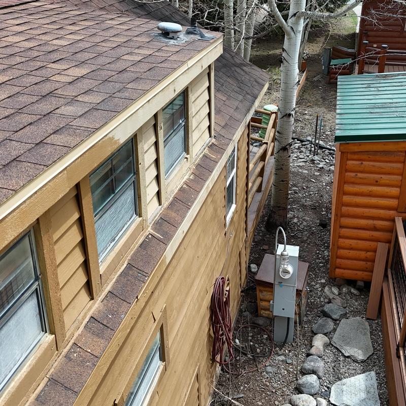 Asphalt shingle roof and wooden wall exterior view