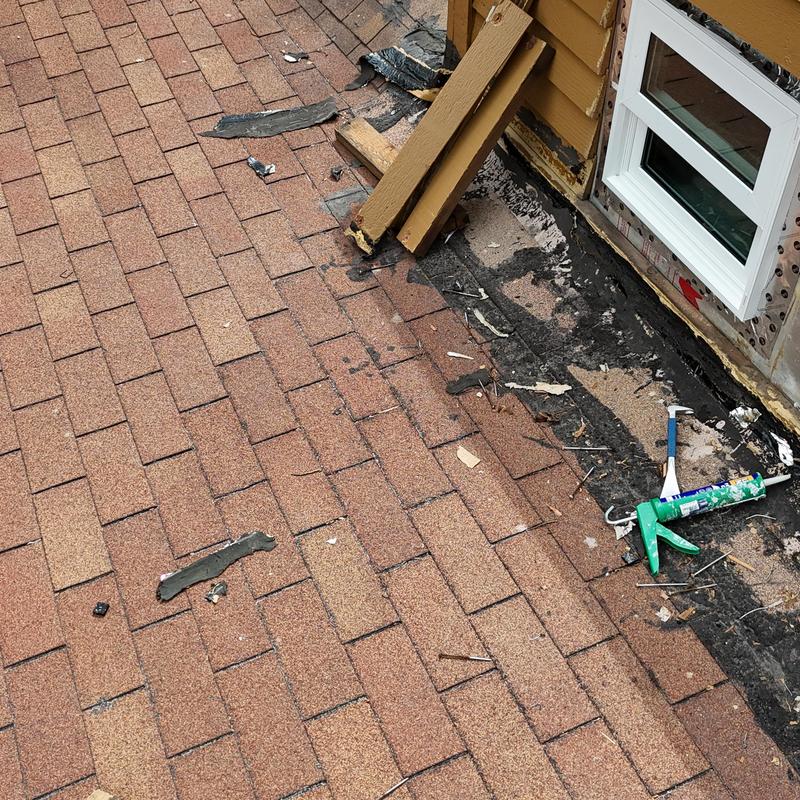 Asphalt shingle roof edge with window flashing repair tools