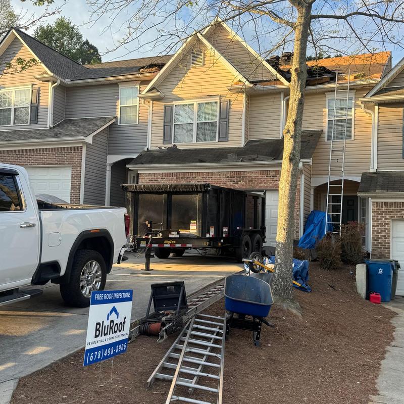 Asphalt shingle roof with ladder and equipment