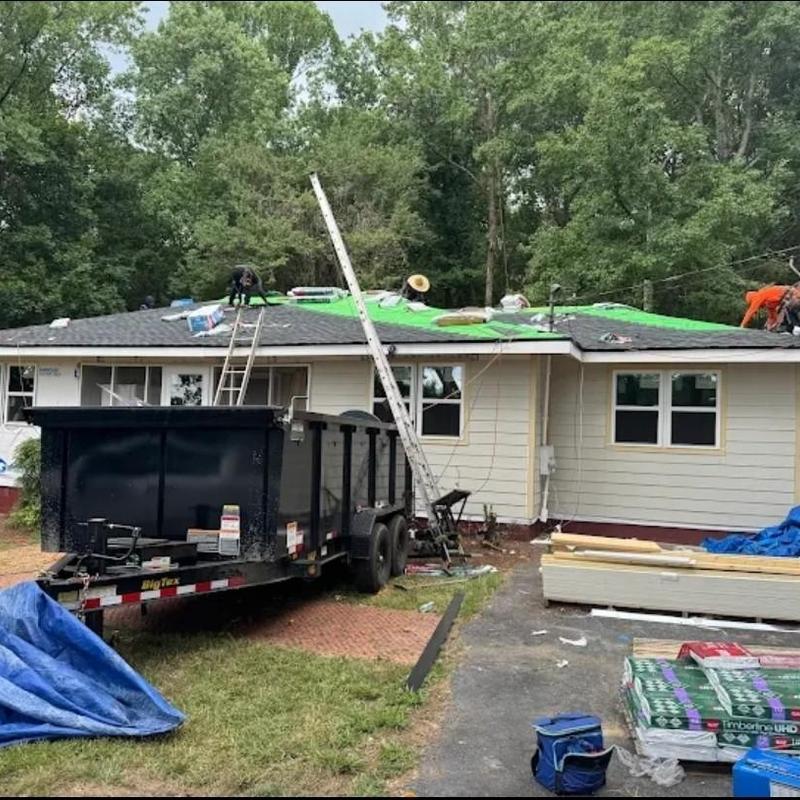 Asphalt shingle roof installation on residential house