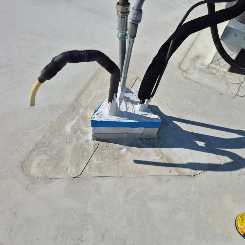 TPO pipe penetration flashing with sealed base and welds