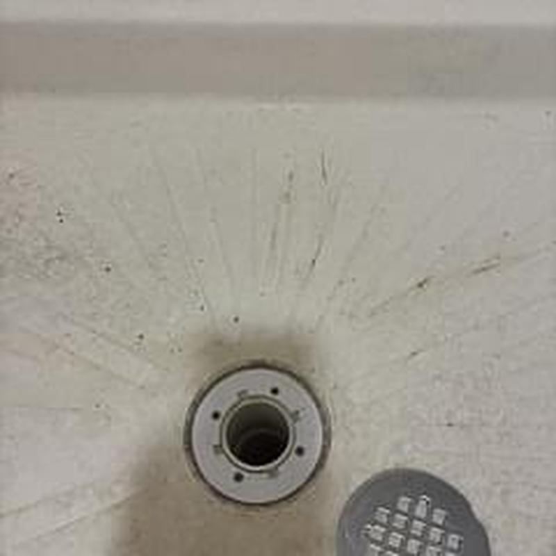 Shower drain flange in master bath tub before replacement