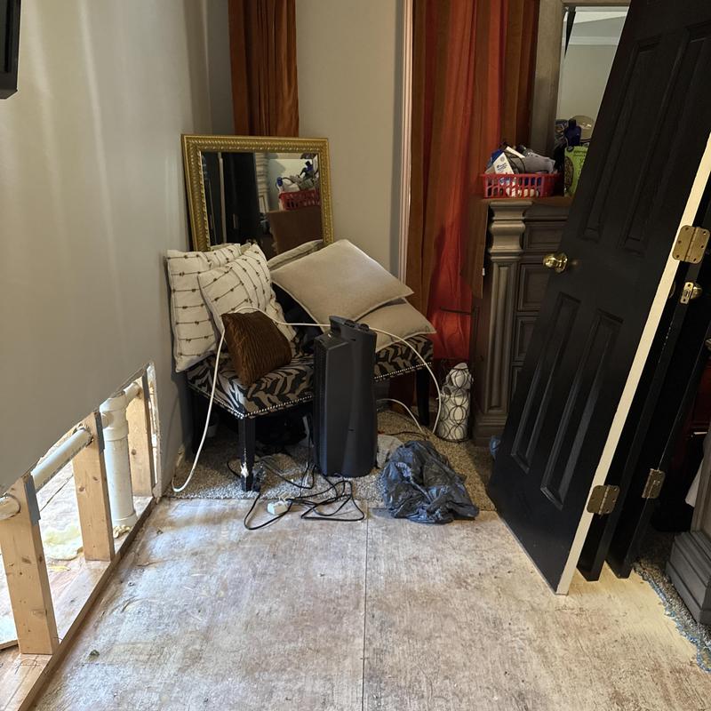 Main line leak water damage with removed drywall panel