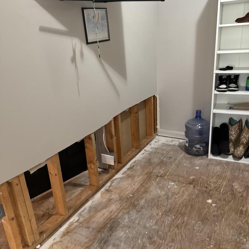 Sheetrock removal and subfloor damage in bedroom
