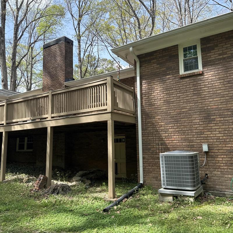 Wood deck replacement with railing on brick house