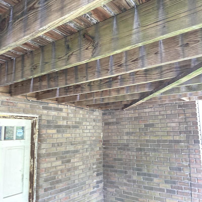 Wooden deck framing and joists under existing deck