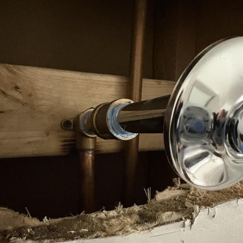 Shower arm pipe connection with chrome flange in wall cavity