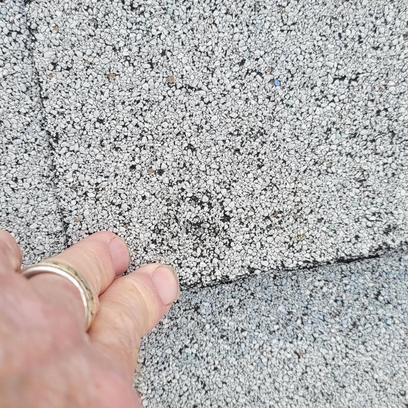 Asphalt shingle close-up showing hail damage in Terrell, TX