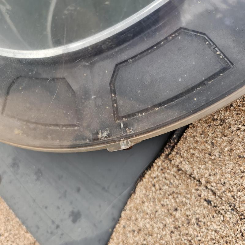 Plastic dome skylight with hail impact damage on roof