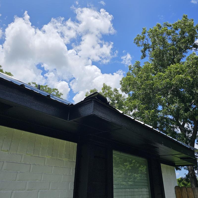 Roof metal panel with hail damage on edge section