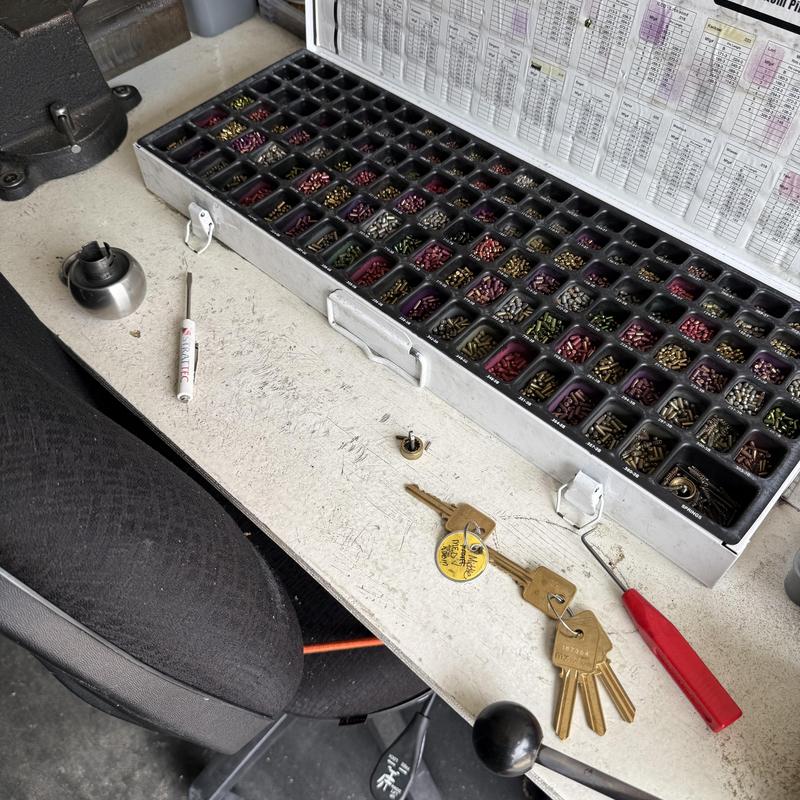 MX restricted key cylinder pins and keys on workbench