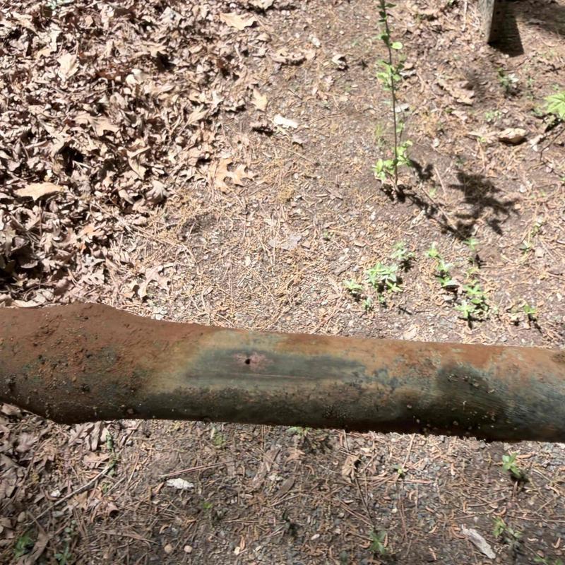 Leaking rusted underground metal pipe excavation site