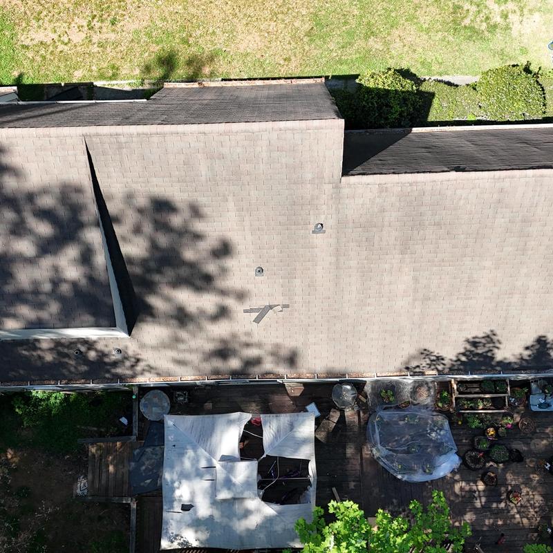 3-tab roof with missing shingles and damaged pipe boot