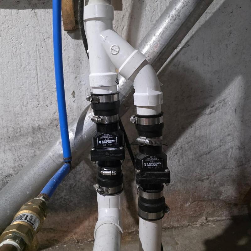 Plastic check valves installed on sump pump discharge pipes