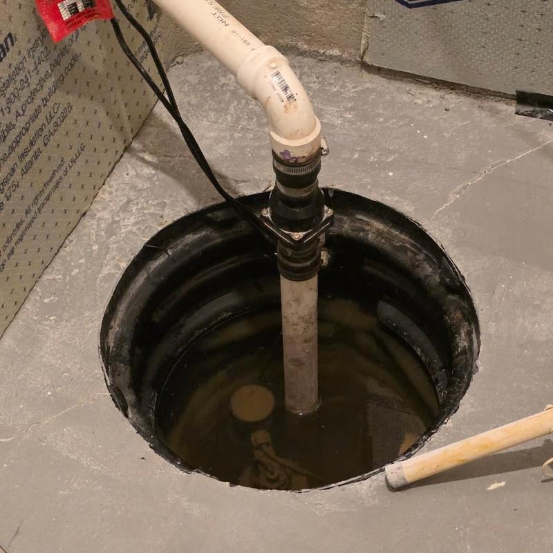 Sump pump and check valve installation in basement pit