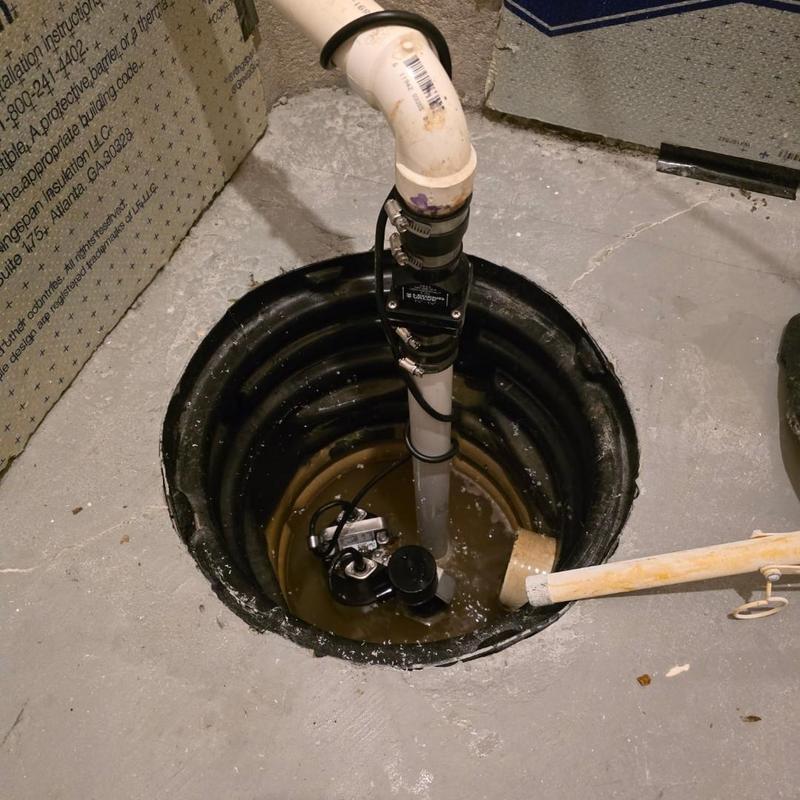 Sump pump system with check valve installation