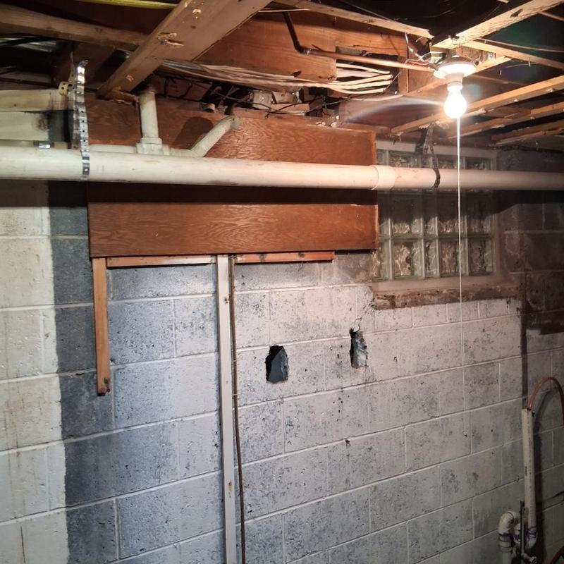 Back pitched PVC drain pipe with cleanout in basement