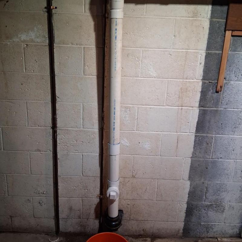 Back pitched PVC drain pipe with cleanout access