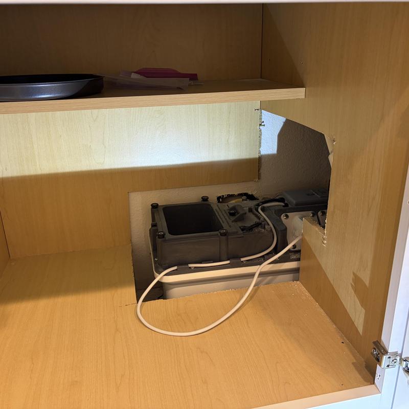 Ejector pump inside basement cabinet with wiring Ejector pump inside basement cabinet with wiring