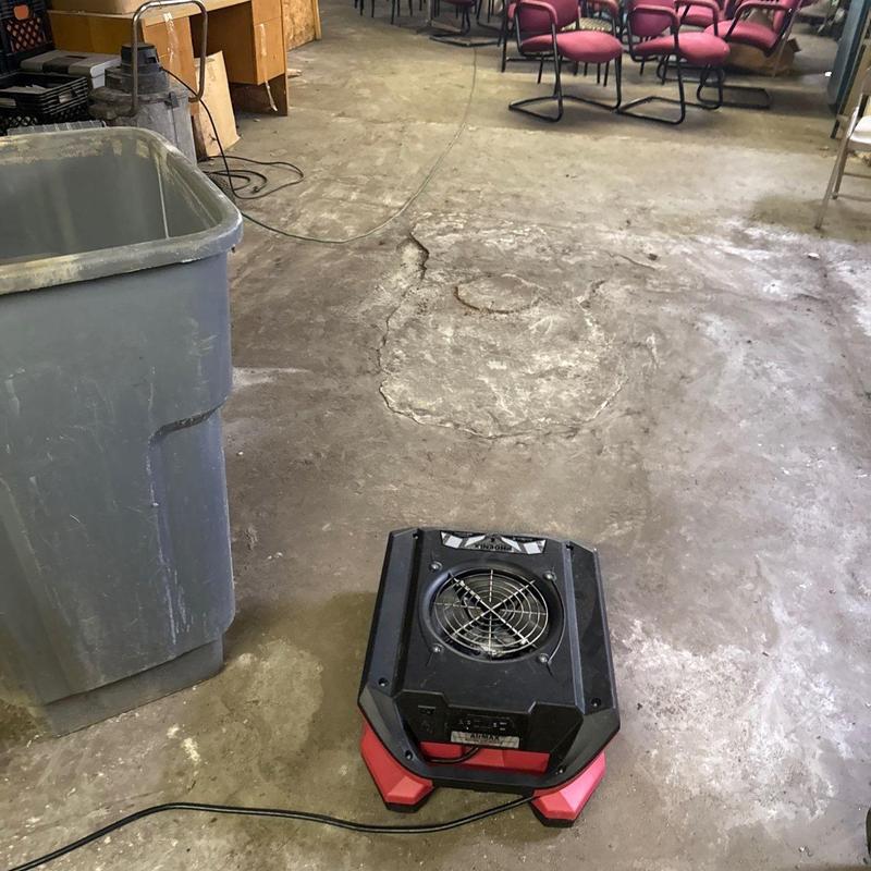 Concrete floor drying fan in commercial room
