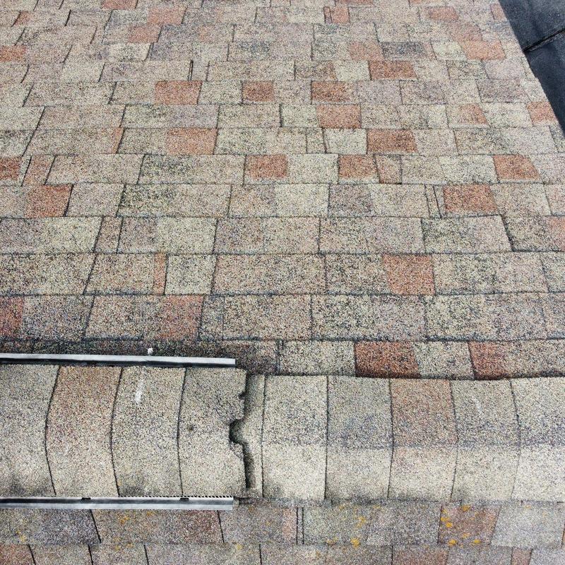 Roof shingles with hail impact and wear damage