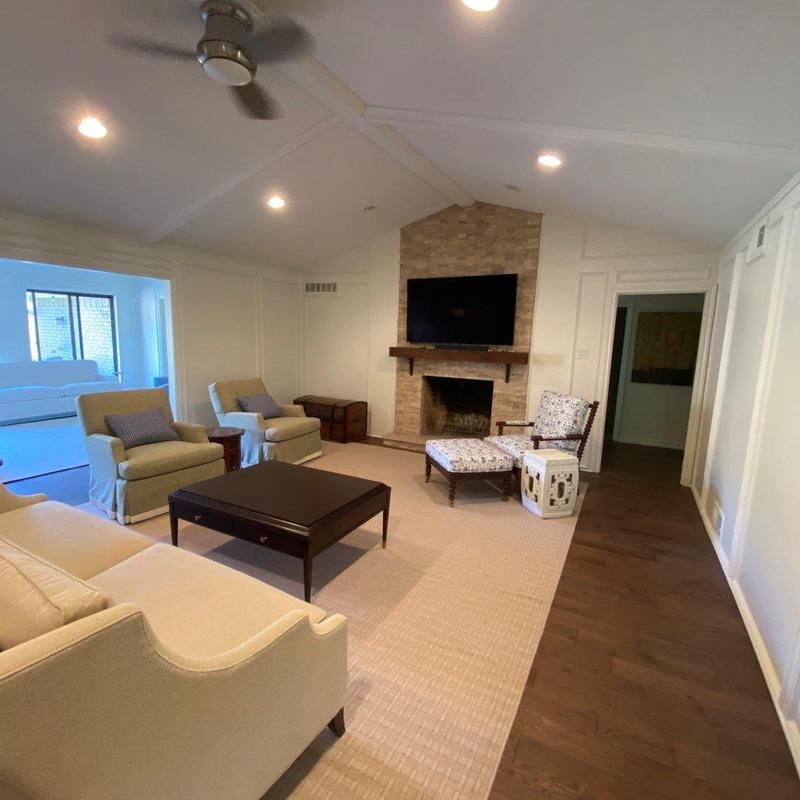Hardwood flooring and fireplace in living room