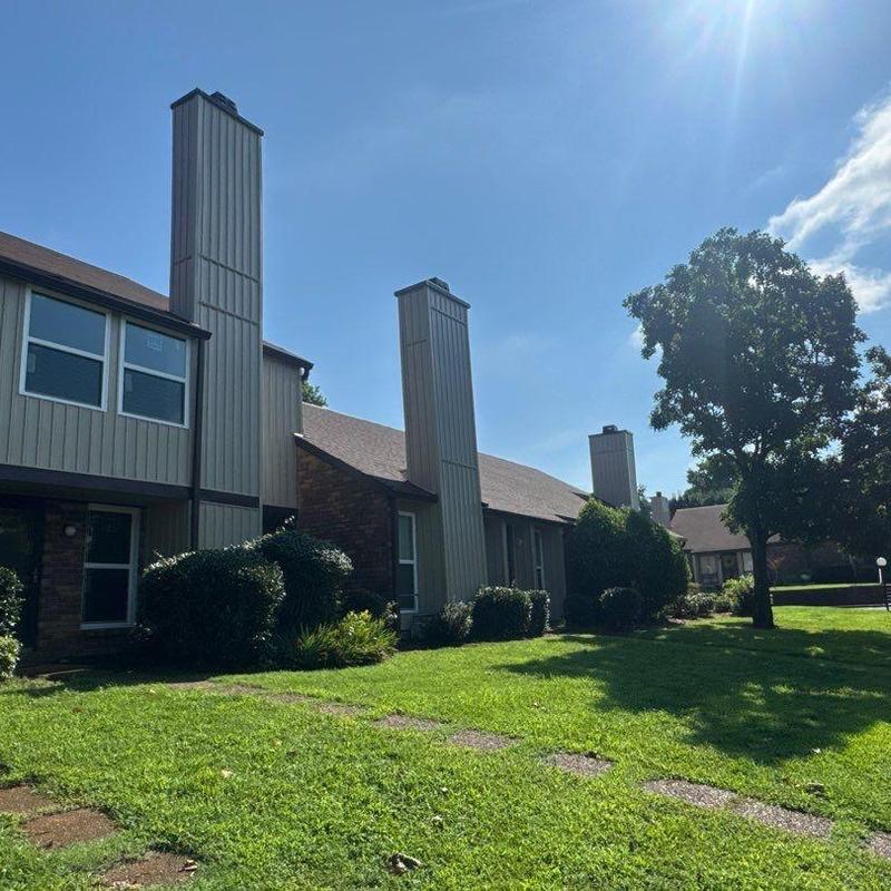 Roof shingles with hail damage on townhouse roof
