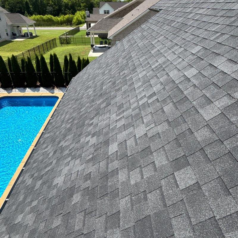 Asphalt shingle roof with hail damage and granule loss