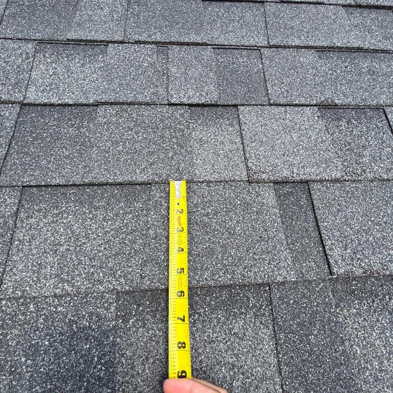 Asphalt roof shingles with hail damage measurement