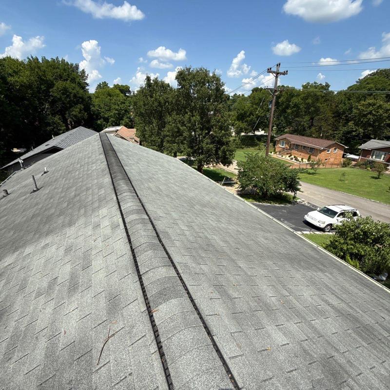 Asphalt shingles and ridge flashing roof inspection