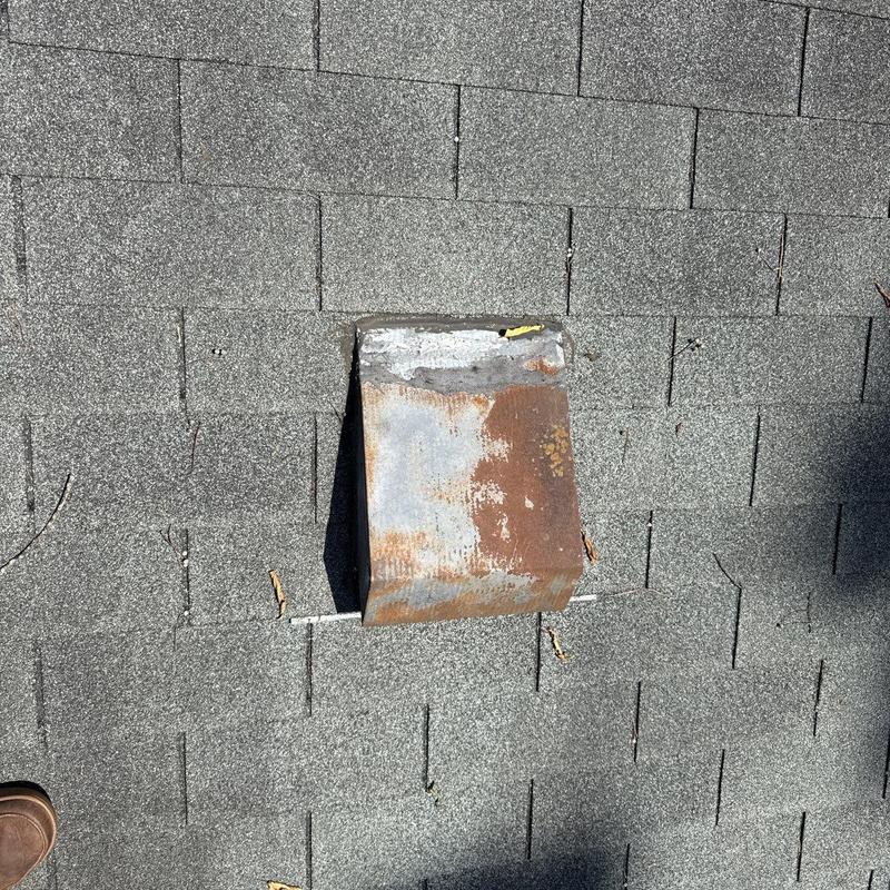 Roof flashing with rust and shingle wear