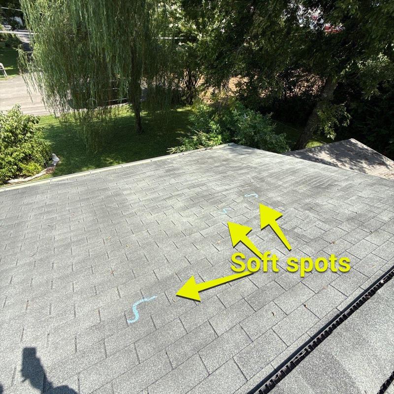 Roof shingles with marked soft spots from hail damage