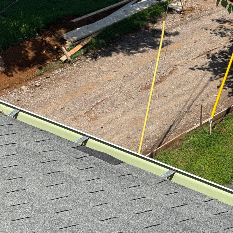 Roof shingles and metal flashing with hail damage inspection