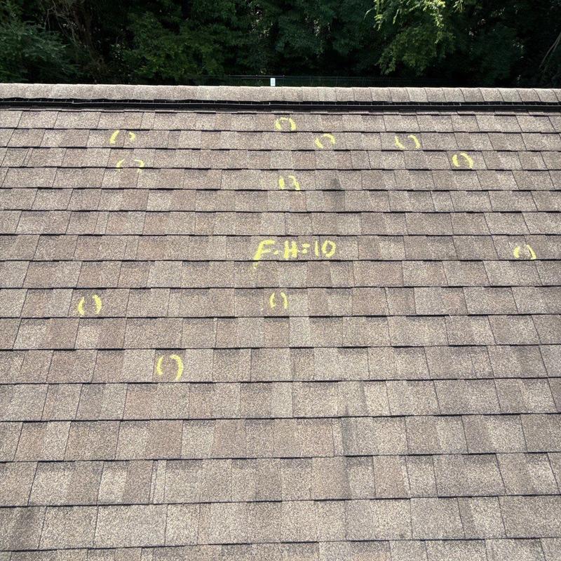 Roof shingles with hail damage markings