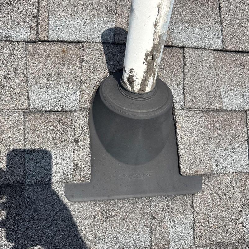 Roof pipe flashing with seal on asphalt shingles