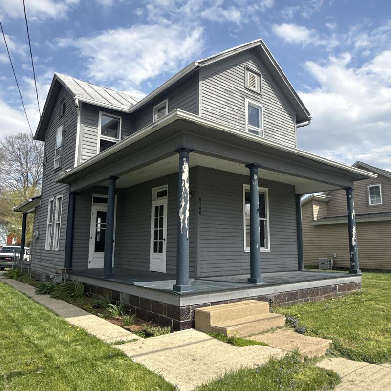Metal roof with siding and gutter inspection on house Metal roof with siding and gutter inspection on house