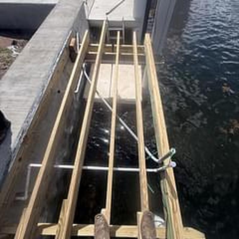 Dock water line installation with new wooden frame