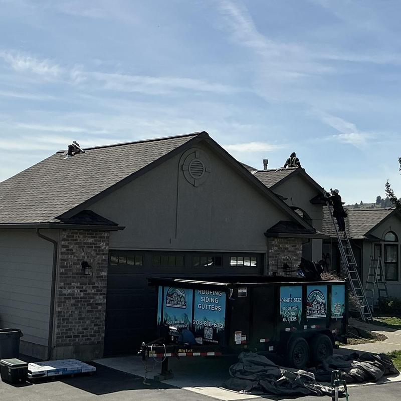 Roof shingles replacement on residential home with crew