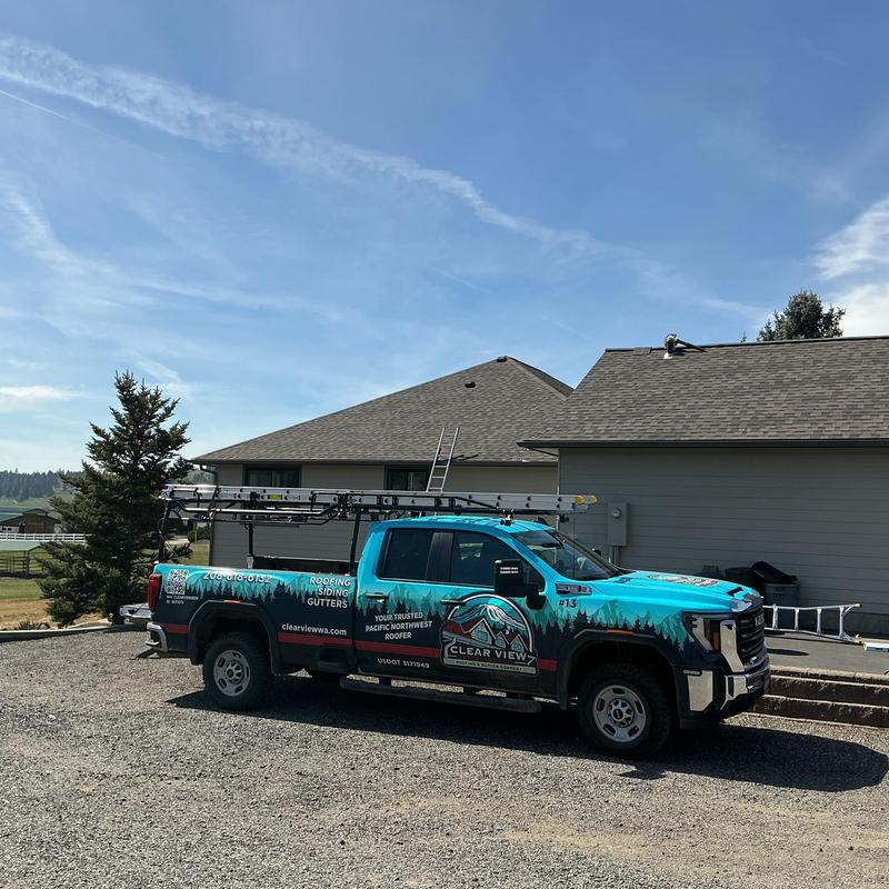 Roof shingles replacement truck parked at residential home