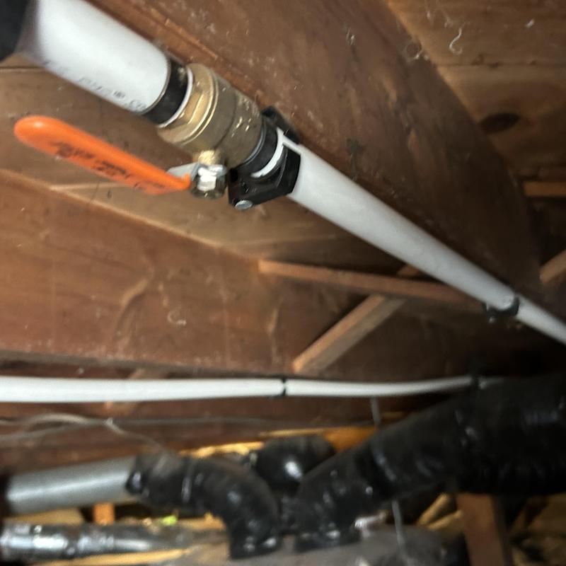 Irrigation hose bib valve with PVC piping in crawl space Irrigation hose bib valve with PVC piping in crawl space