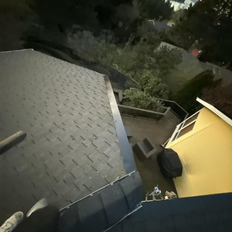 Ridge caps and shingles on residential roof edge