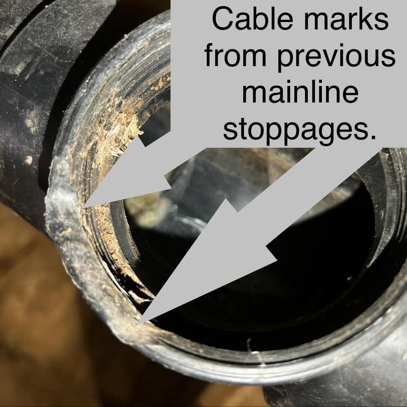 Sewer mainline pipe with cable marks from stoppages