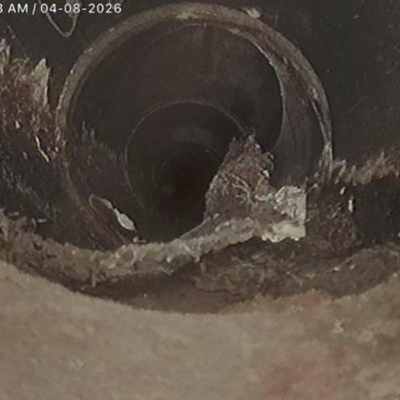 Sewer pipe interior with corrosion and buildup