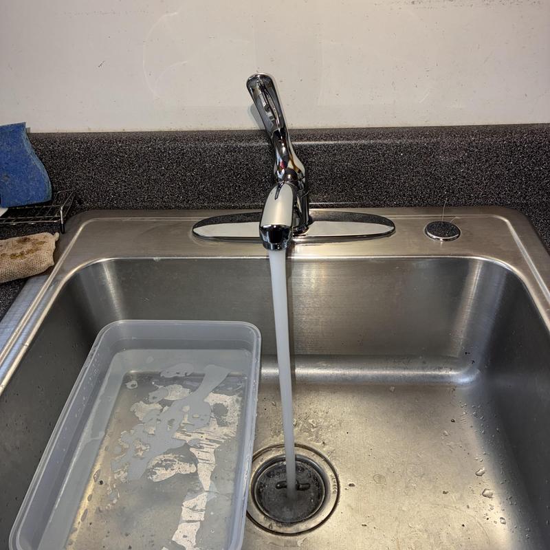 Kitchen sink faucet with new supply hoses running water
