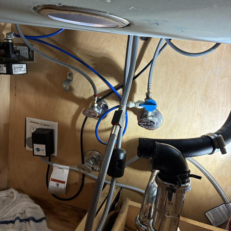 Water filtration system tubing and connections under sink