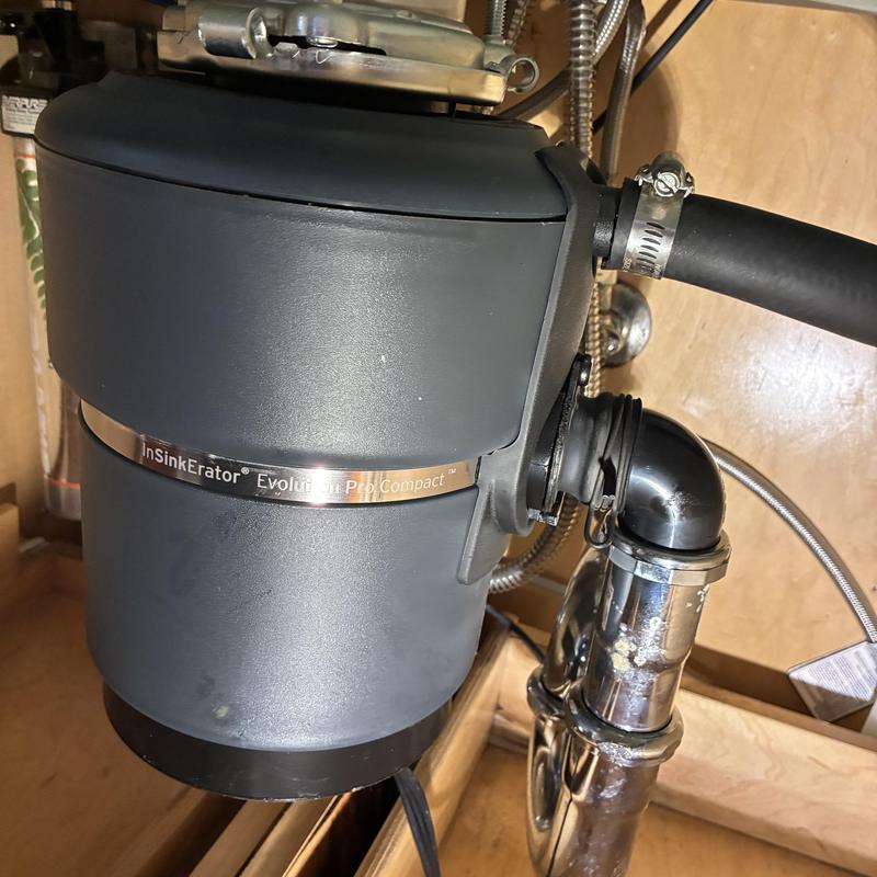 Garbage disposal unit installation under kitchen sink