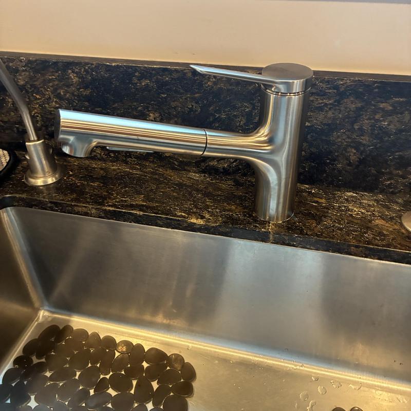 Kitchen faucet installed with granite countertop sink