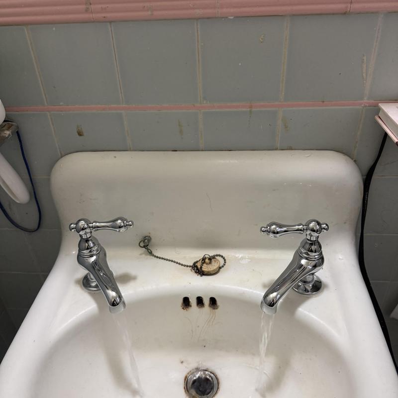 Laundry sink with new faucet and running water