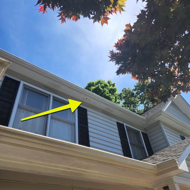 Soffit panel with holes on house exterior