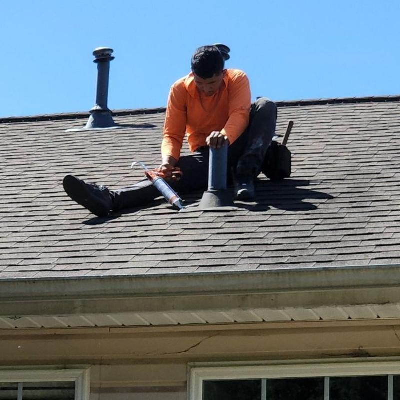 Roof vent sealing with caulk on shingle roof